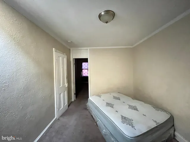 a view of utility room and empty room