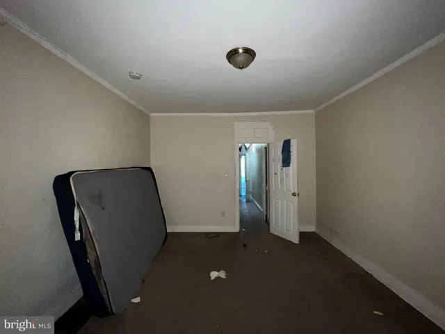 a view of a hallway with seating area