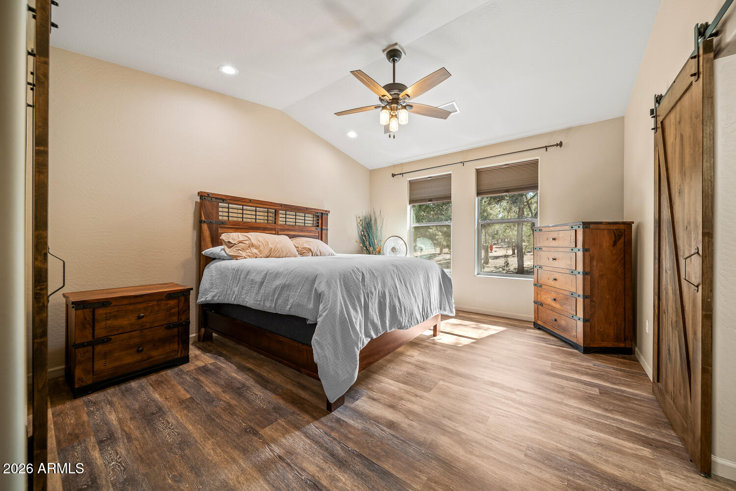 3160 North Eagle Landing Road Show Low, AZ 85901 - Photo 21 of 37 a bedroom with a bed and a chandelier