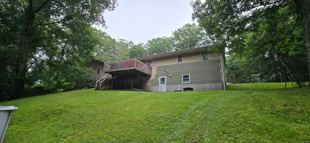 a view of a house with a yard