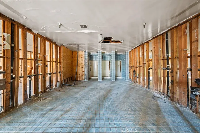 a view of an empty room with windows