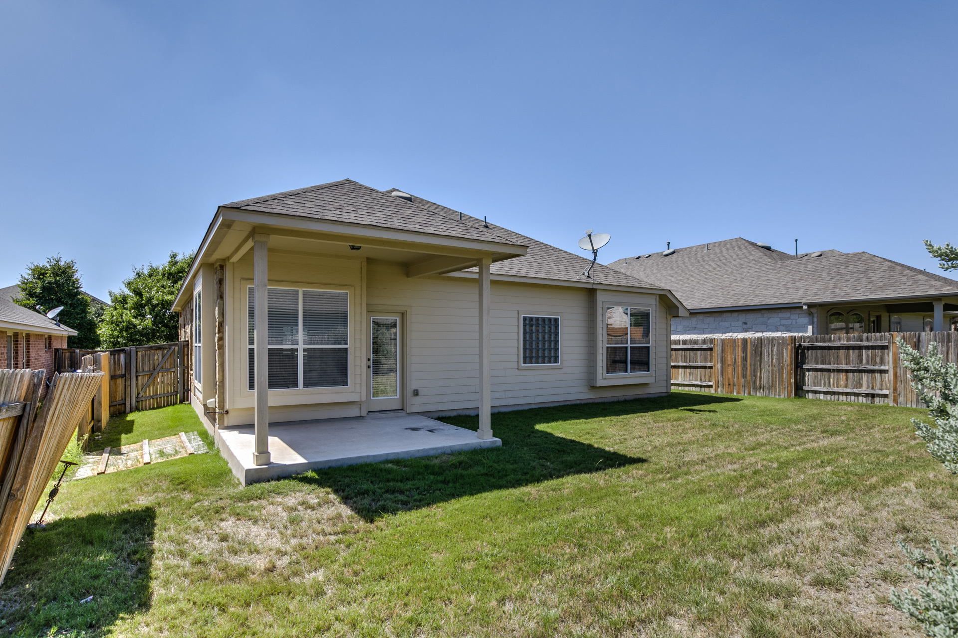 3667 Rosalina Loop Round Rock, TX 78665 - Photo 23 of 26 Rear view of property featuring a patio area, a fenced backyard, a shingled roof, and a gate