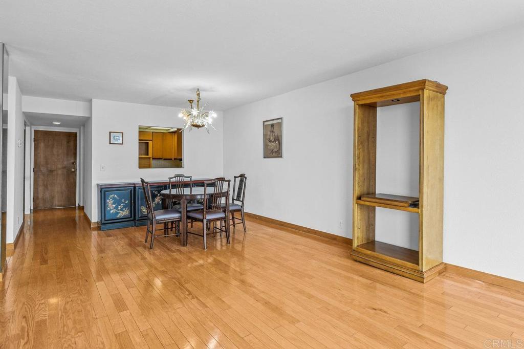 3635 7th Avenue, Unit 13E San Diego, CA 92103 - Photo 11 of 28 a dining room with furniture and chandelier
