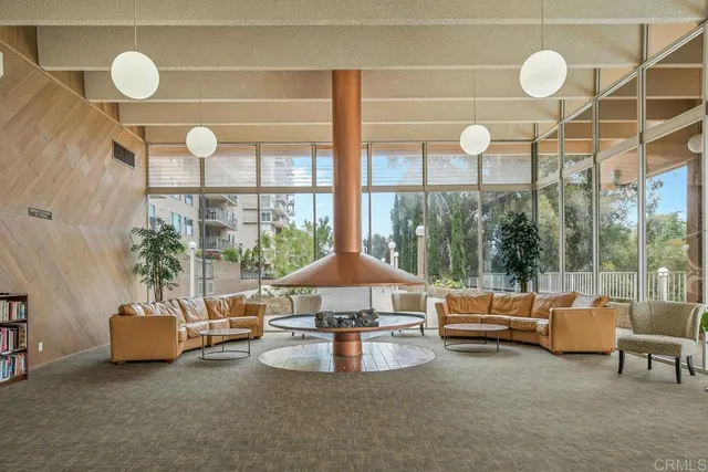 a view of a swimming pool and sitting area