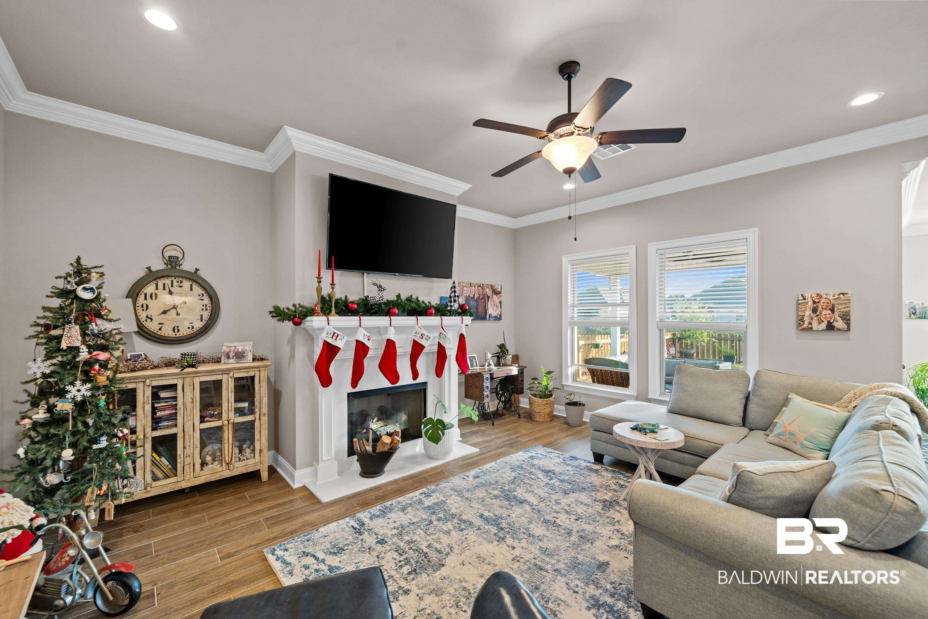 1390 Aldon Street Foley, AL 36535 - Photo 7 of 31 Living area with wood tiled floors, ceiling fan, a fireplace, ornamental molding, and recessed lighting