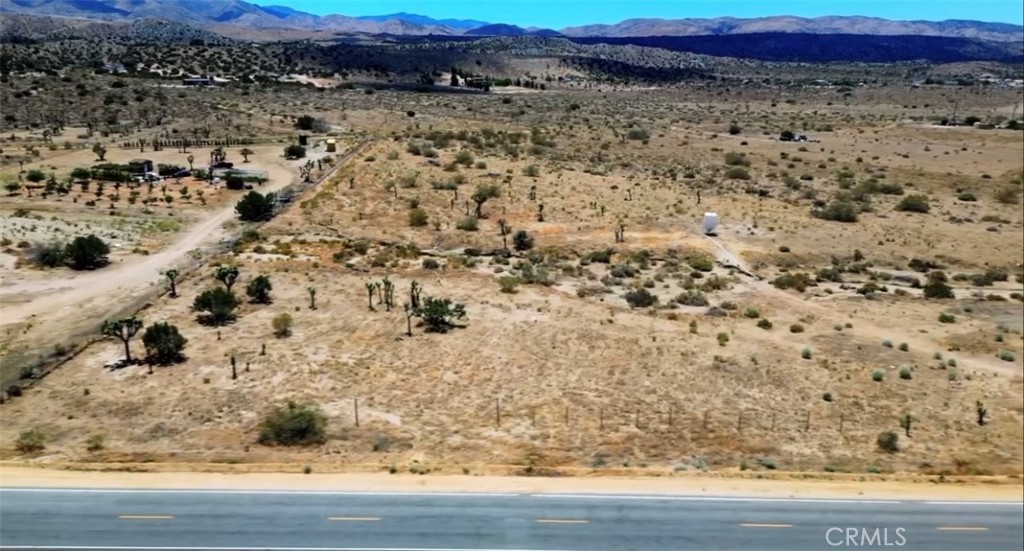 11250 Fort Tejon Road Littlerock, CA 93543 - Photo 6 of 7 a view of a large yard with wooden floor and fence