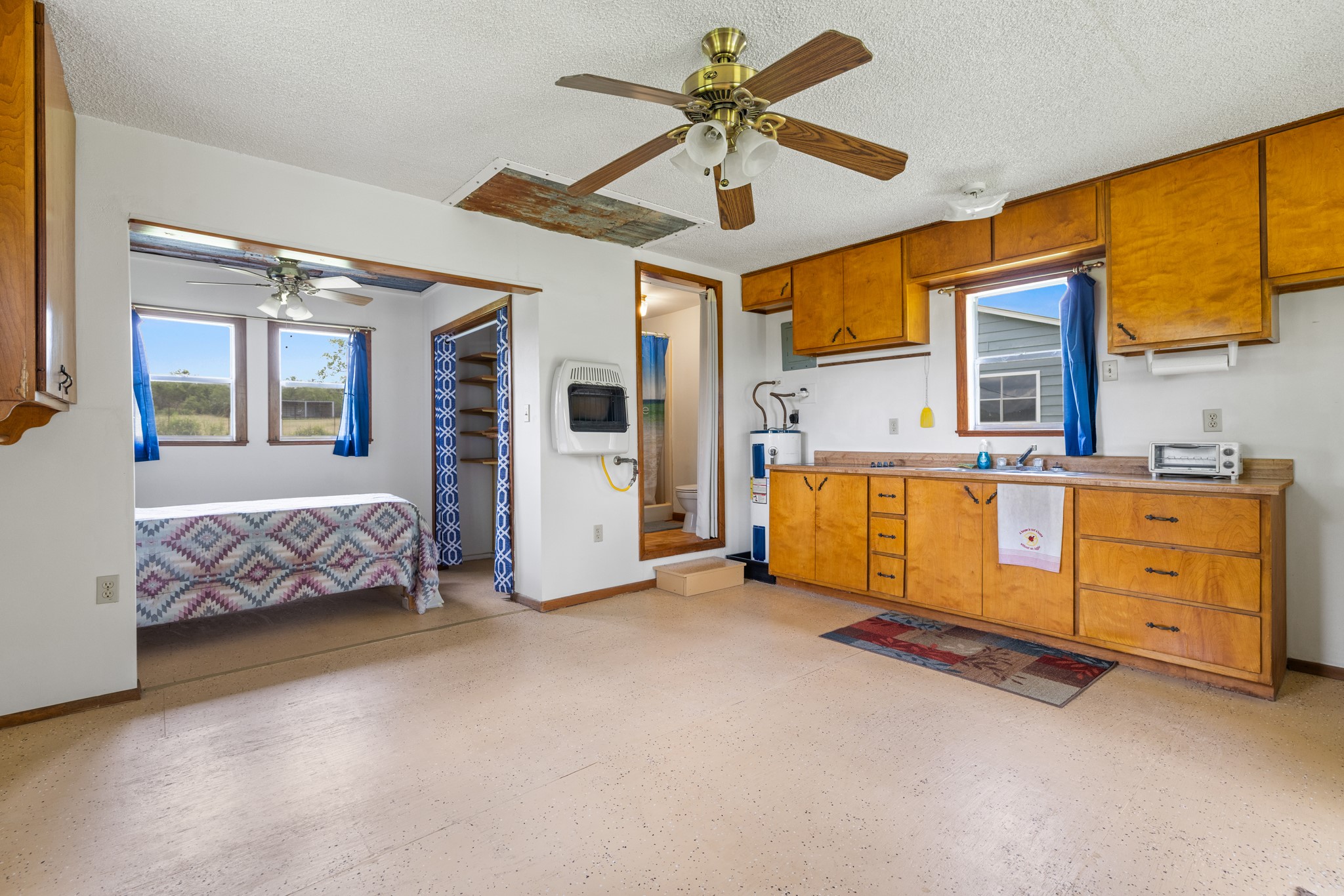 341 River View Road Fredericksburg, TX 78624 - Photo 27 of 40 An open layout integrates the functional kitchen area with nearby living and sleeping spaces.