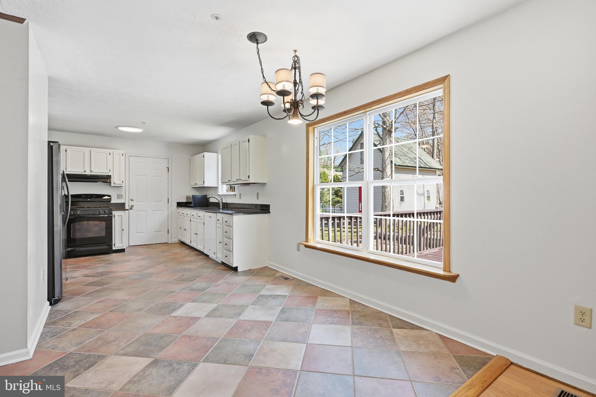 118 Liberty Lane Elkton, MD 21921 - Photo 11 of 31 a kitchen with stainless steel appliances granite countertop a stove top oven a refrigerator a sink and a window