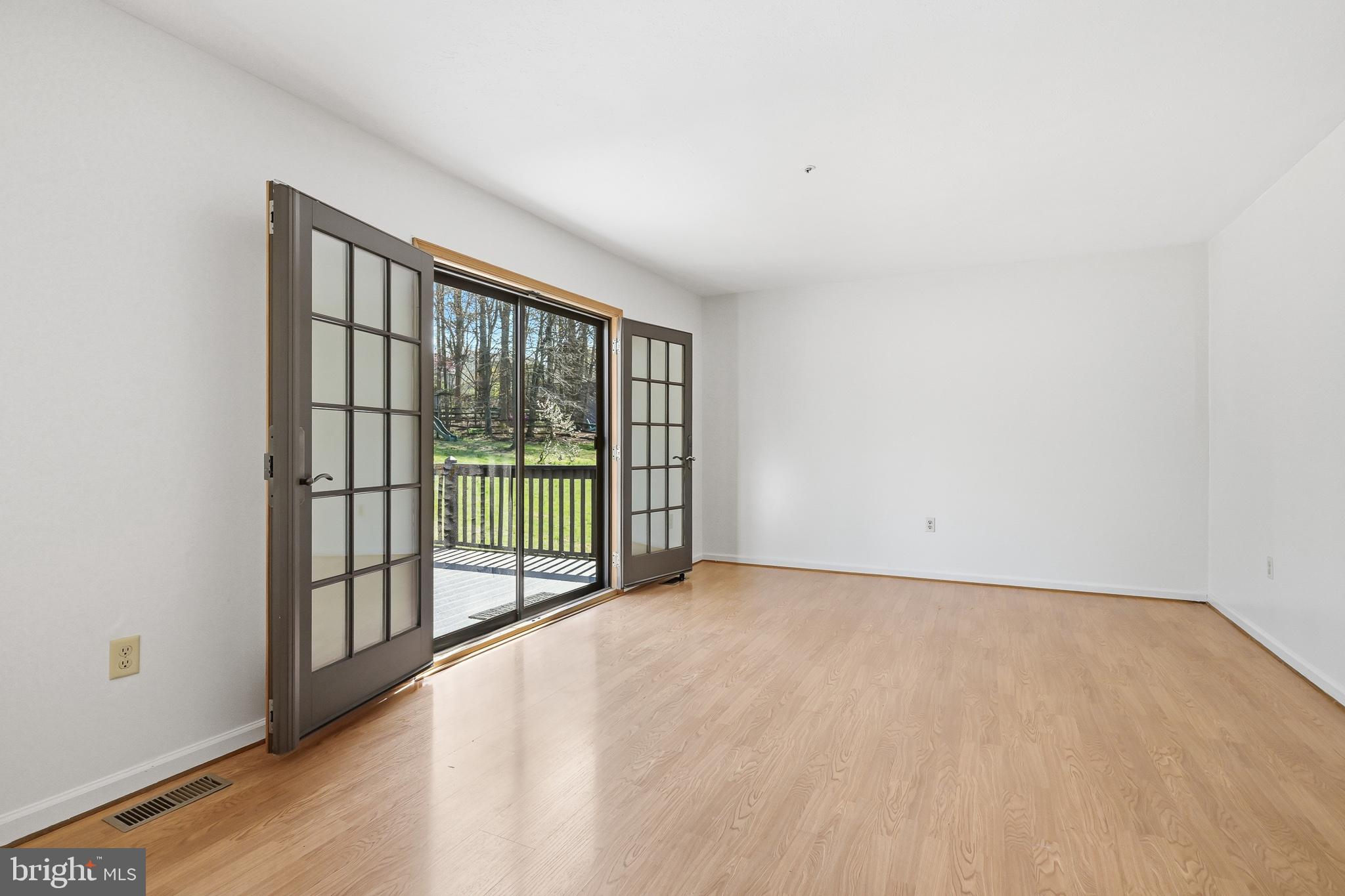 118 Liberty Lane Elkton, MD 21921 - Photo 12 of 31 a view of an empty room with wooden floor and a window