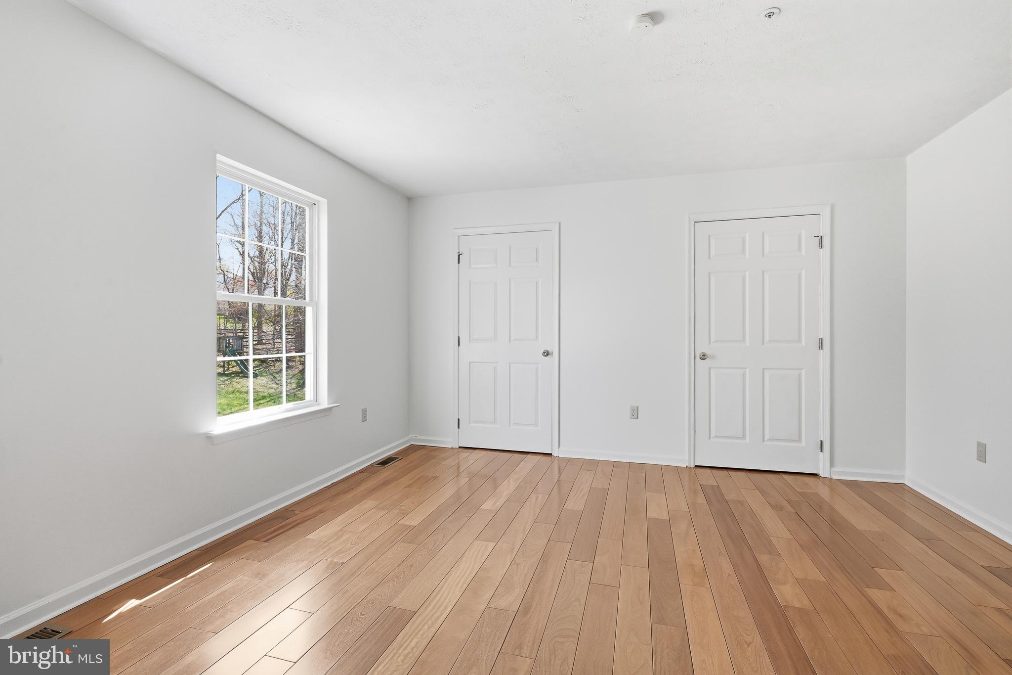 118 Liberty Lane Elkton, MD 21921 - Photo 20 of 31 a view of an empty room with wooden floor and a window