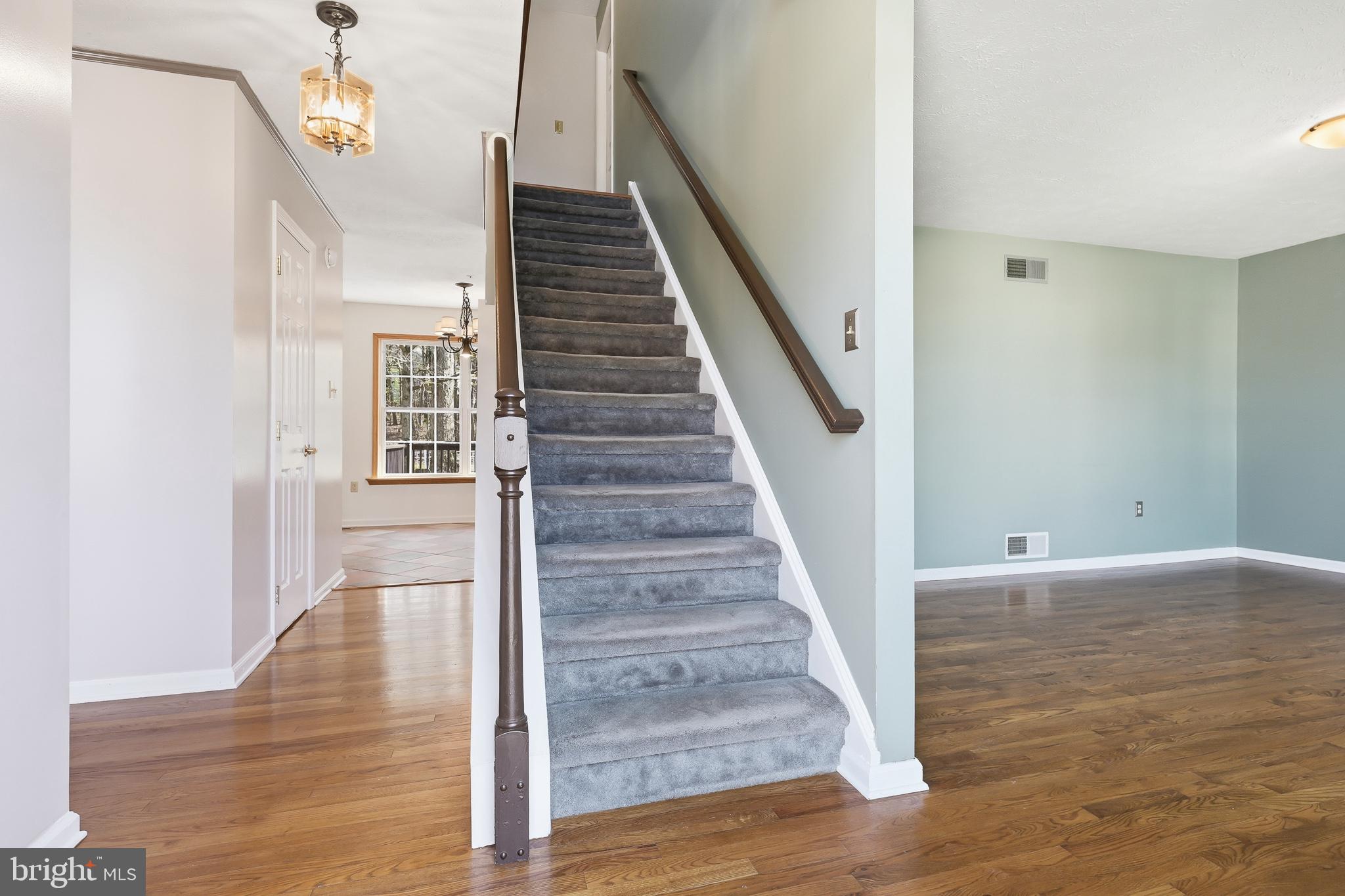 118 Liberty Lane Elkton, MD 21921 - Photo 2 of 31 a view of a hallway with wooden floor and staircase