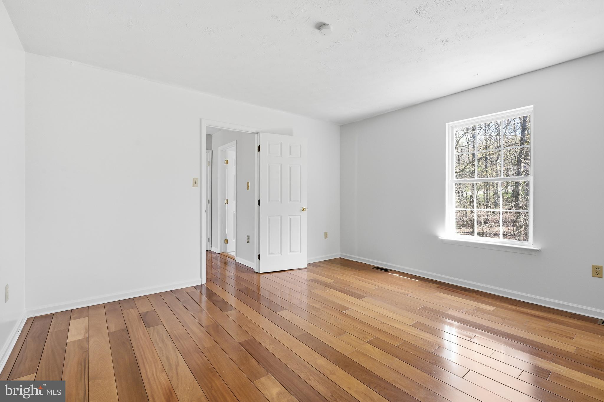 118 Liberty Lane Elkton, MD 21921 - Photo 21 of 31 an empty room with wooden floor and windows