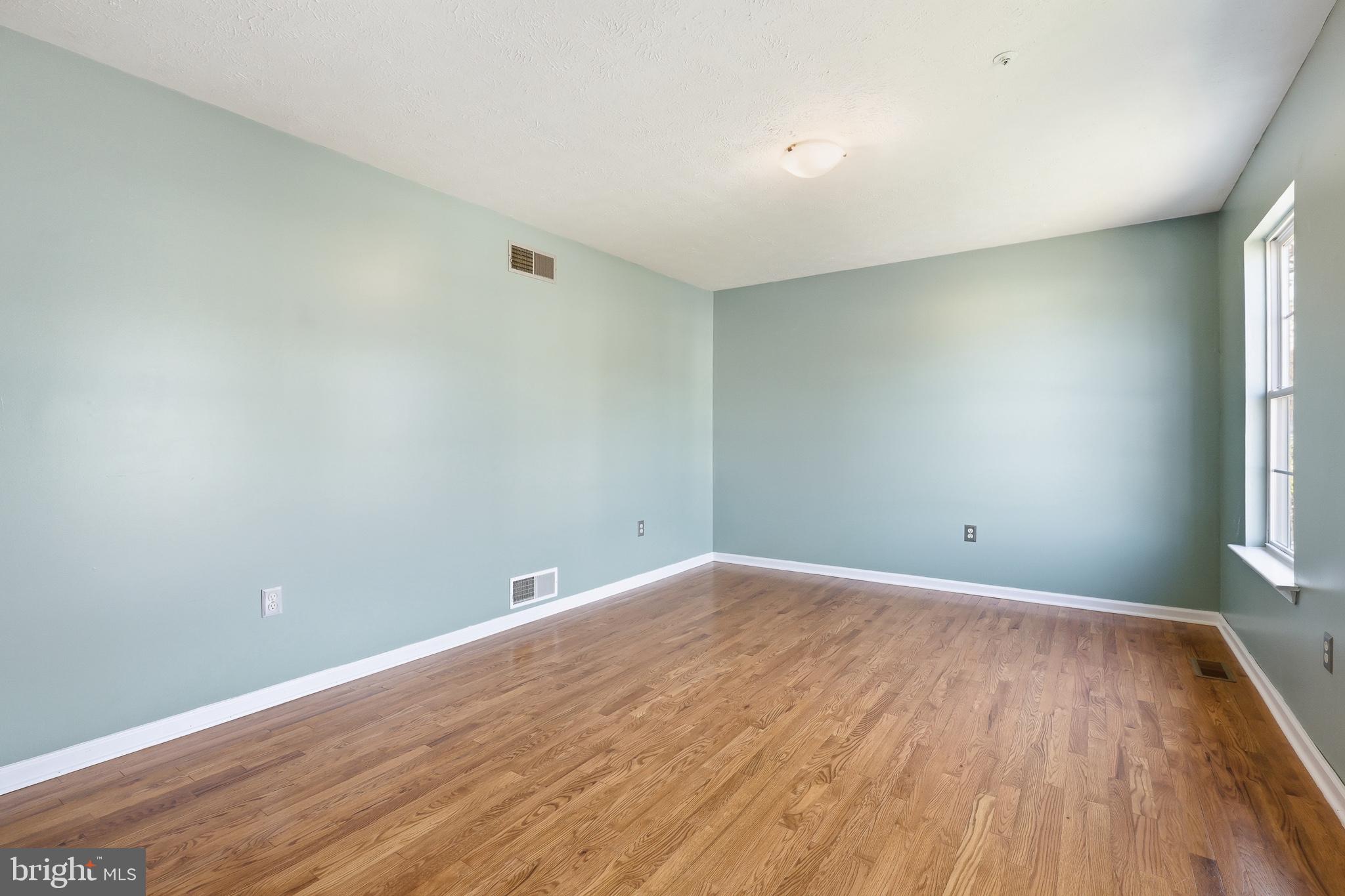 118 Liberty Lane Elkton, MD 21921 - Photo 3 of 31 a view of room with window and wooden floor