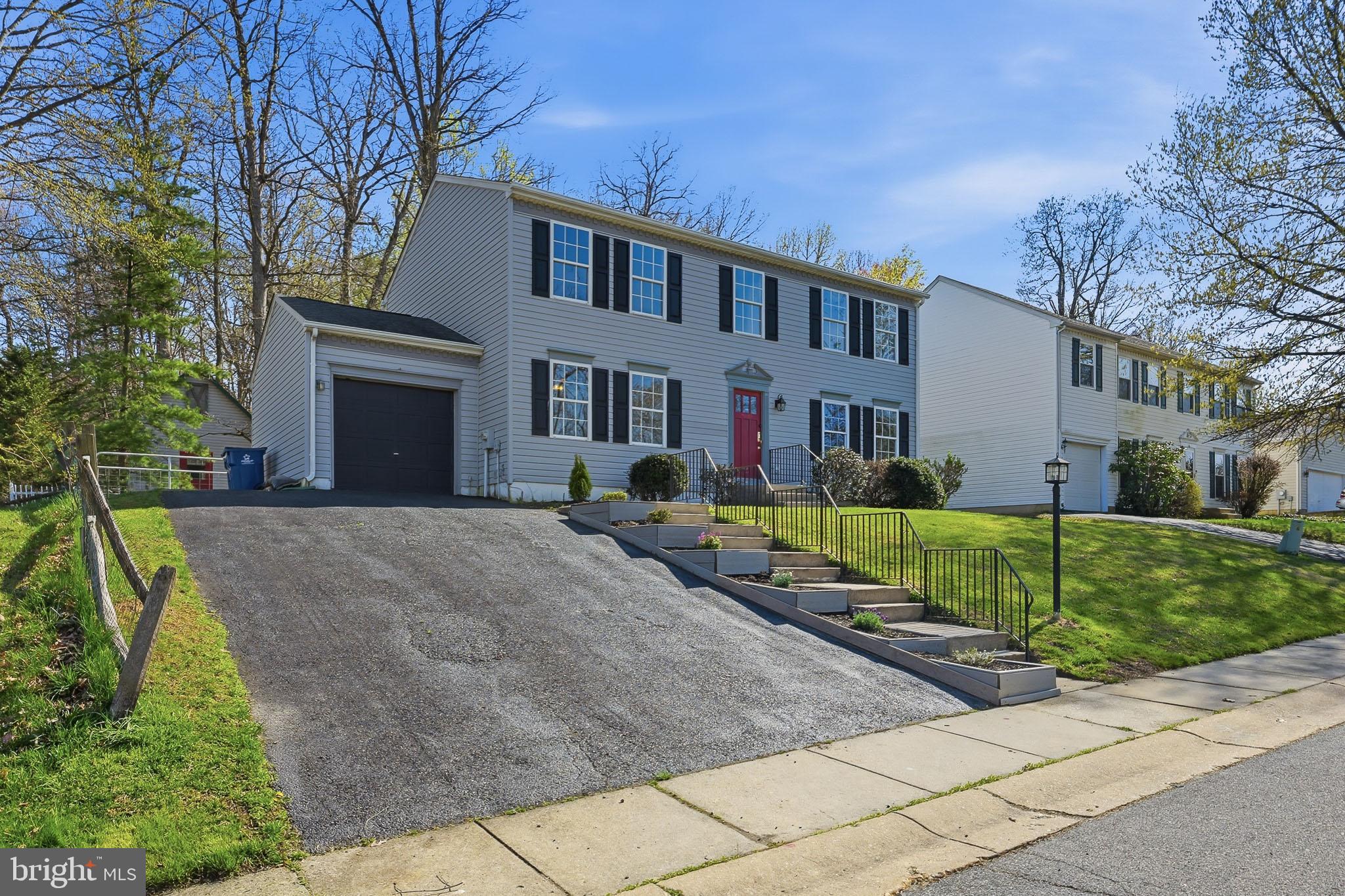 118 Liberty Lane Elkton, MD 21921 - Photo 31 of 31 a front view of a house with a yard and potted plants