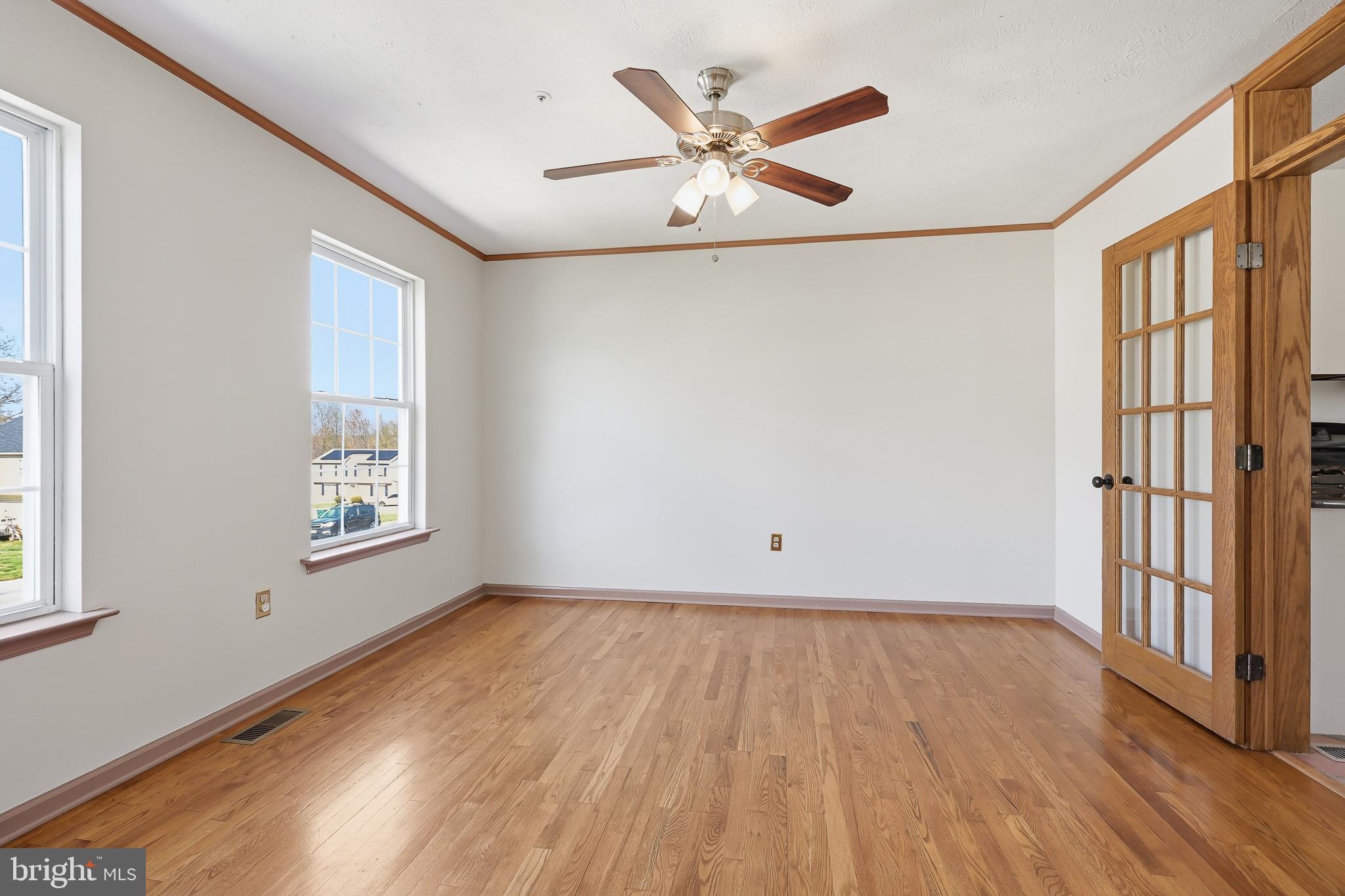 118 Liberty Lane Elkton, MD 21921 - Photo 5 of 31 wooden floor in an empty room with a window