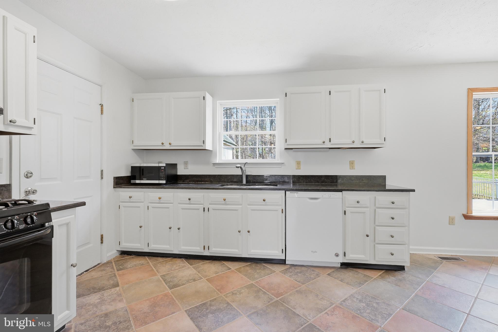 118 Liberty Lane Elkton, MD 21921 - Photo 9 of 31 a kitchen with granite countertop white cabinets and stainless steel appliances