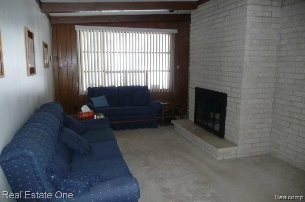 5981 West Hayner Road Fowlerville, MI 48836 - Photo 9 of 31 FAMILY ROOM WITH THRU FIREPLACE TO LIVING ROOM