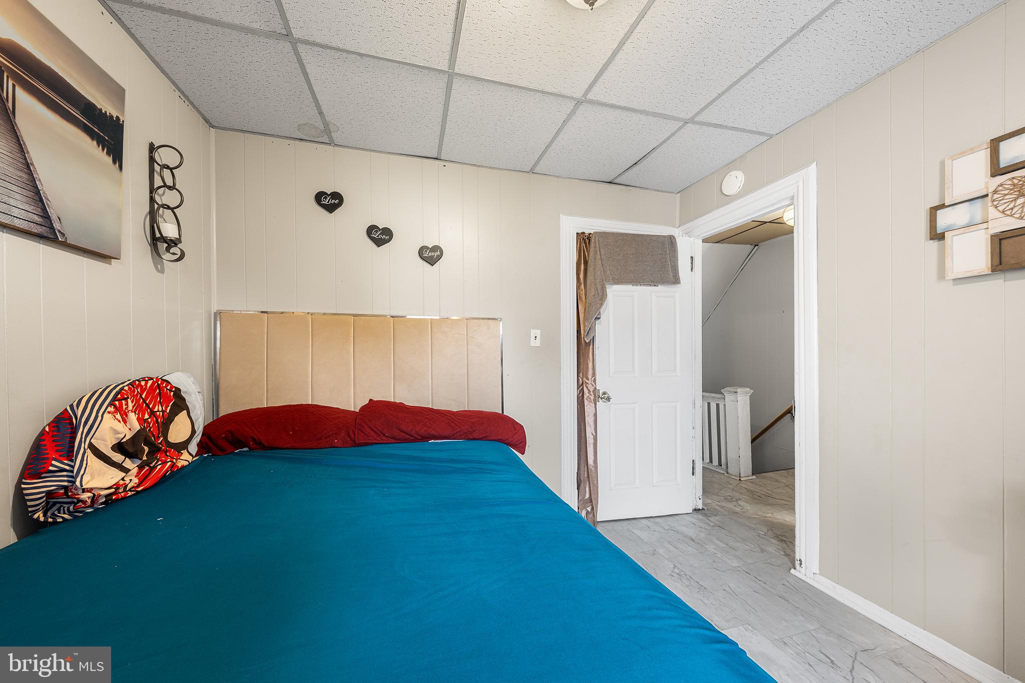 707 East 5th Street Bethlehem, PA 18015 - Photo 12 of 22 a bedroom with a bed and a painting on the wall