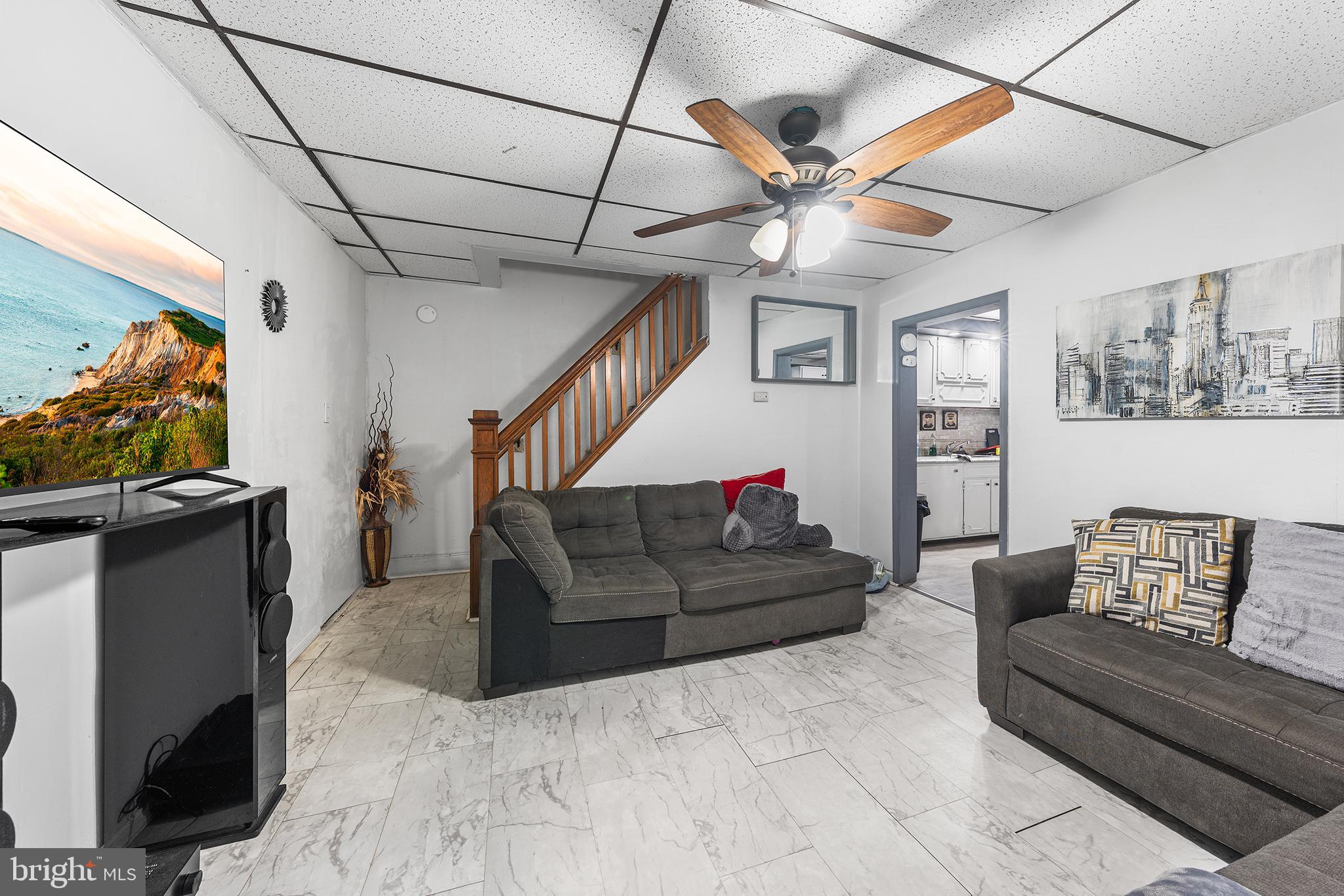 707 East 5th Street Bethlehem, PA 18015 - Photo 4 of 22 a living room with furniture and a ceiling fan