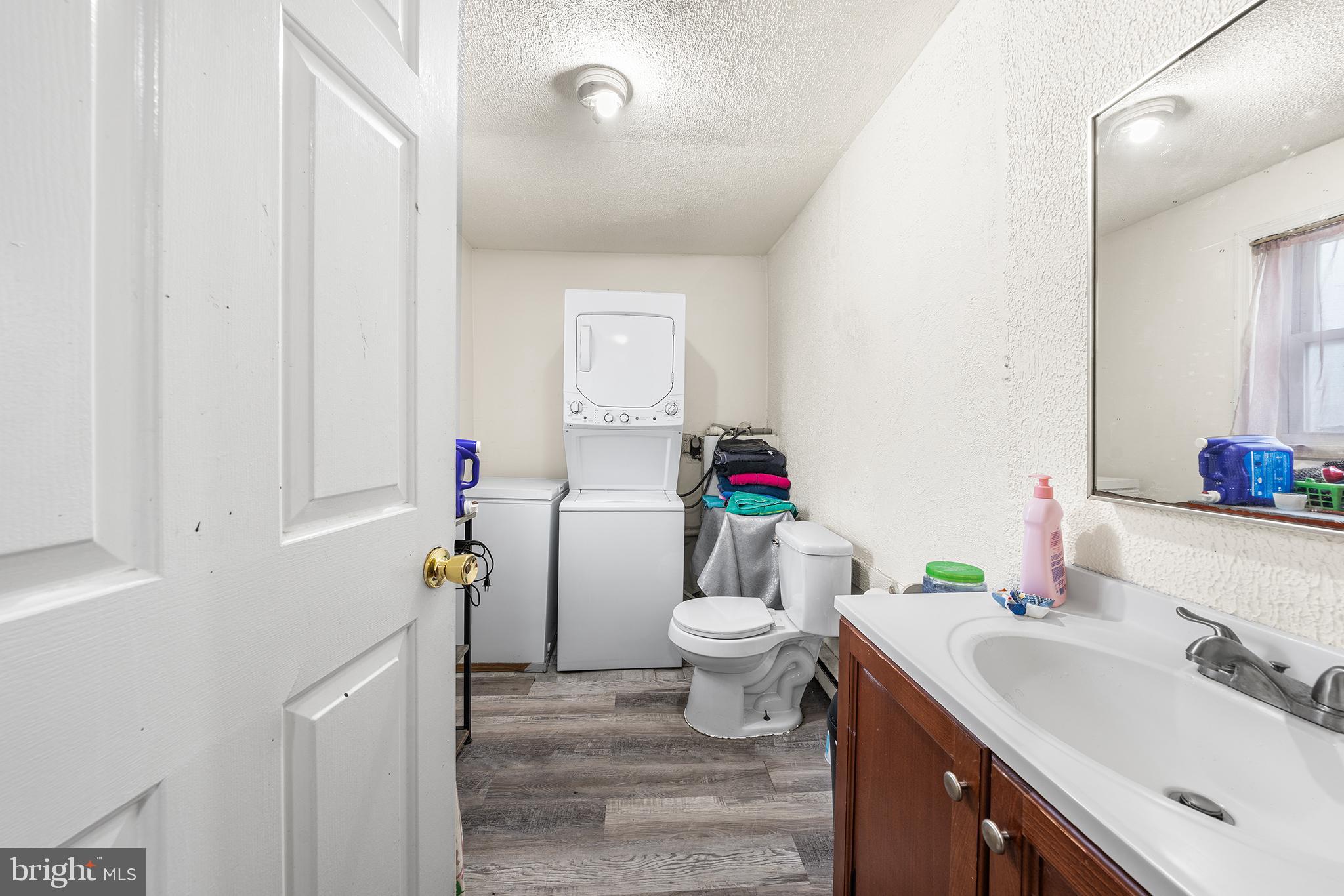 707 East 5th Street Bethlehem, PA 18015 - Photo 8 of 22 a bathroom with a sink toilet and vanity