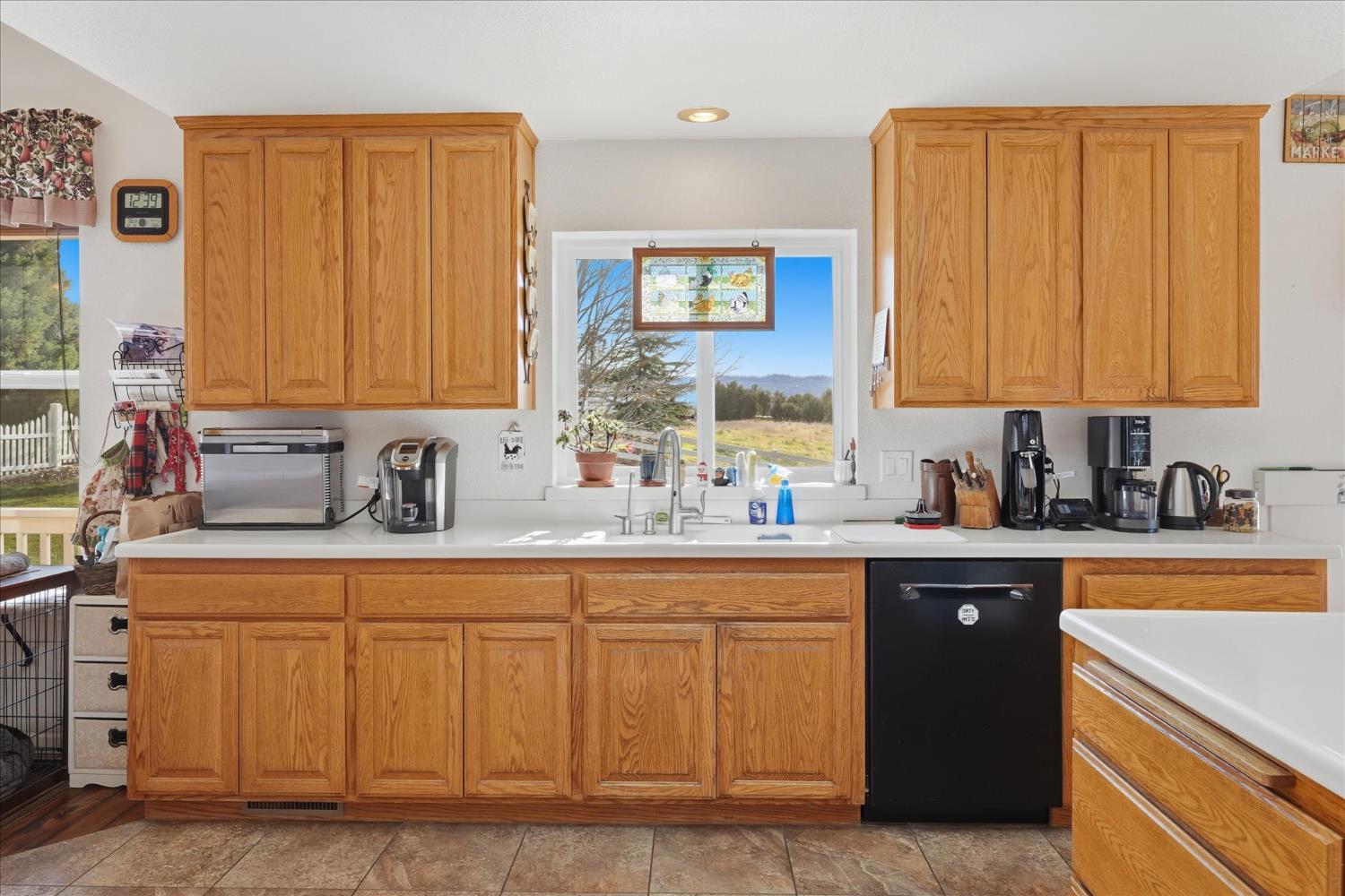 43319 Leach Road Ahwahnee, CA 93601 - Photo 21 of 61 a kitchen with stainless steel appliances granite countertop a sink stove and cabinets