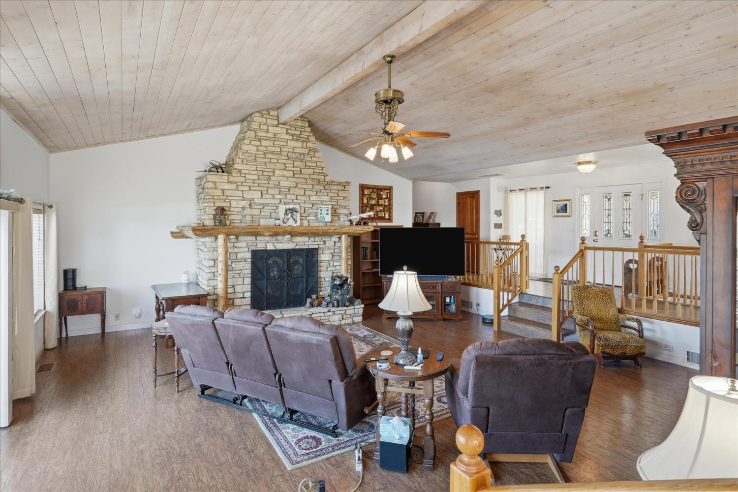 43319 Leach Road Ahwahnee, CA 93601 - Photo 25 of 61 a living room with furniture a fireplace and a chandelier