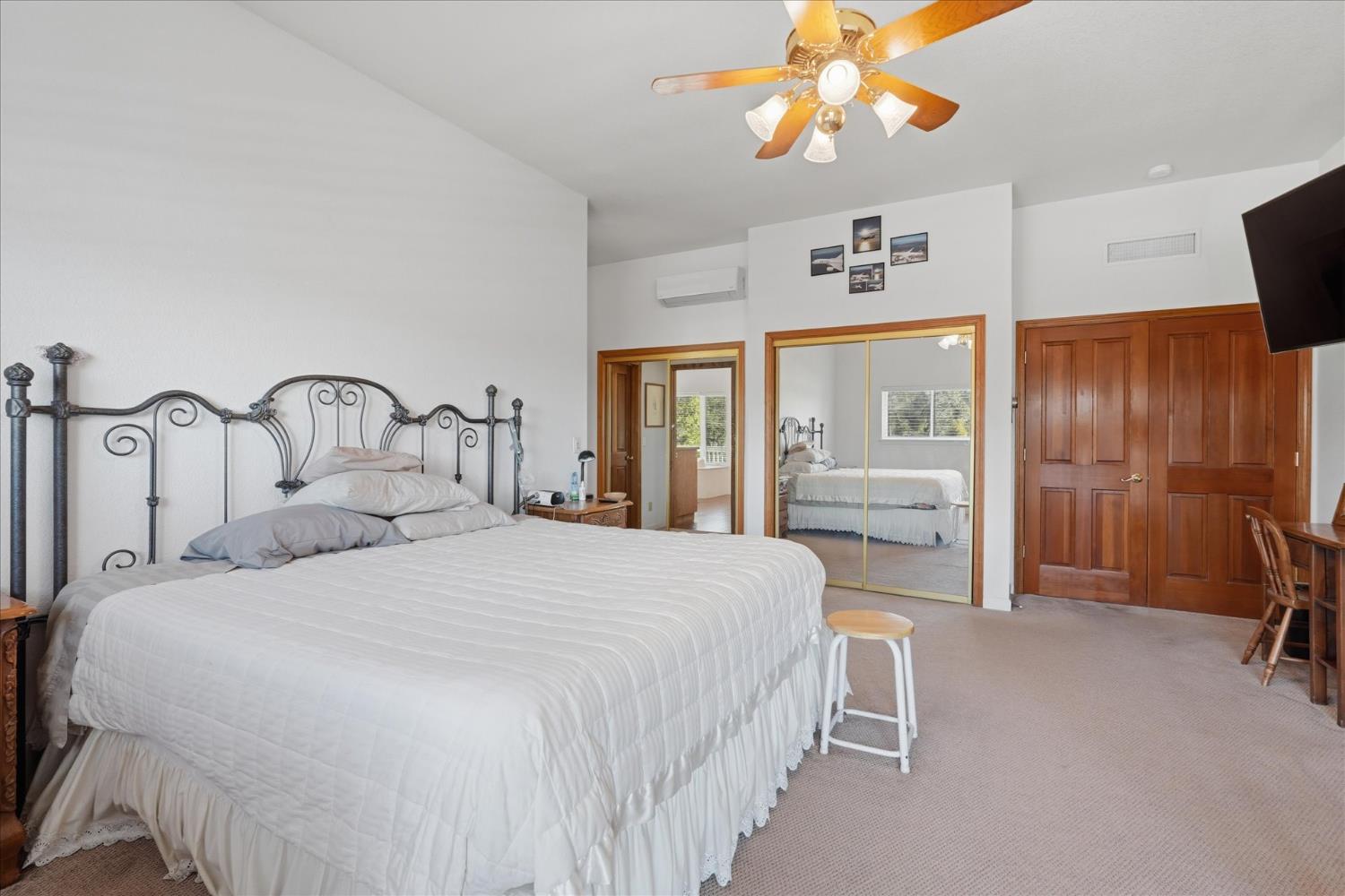 43319 Leach Road Ahwahnee, CA 93601 - Photo 27 of 61 a bedroom with a bed and a large window