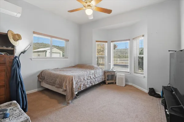 a living room with kitchen island furniture and a kitchen view