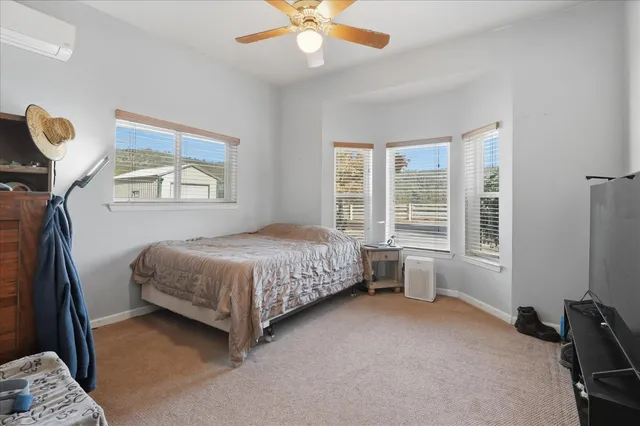 a living room with kitchen island furniture and a kitchen view
