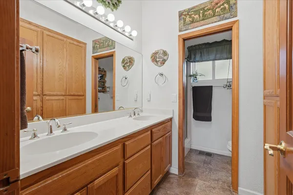 a bathroom with a sink toilet and shower