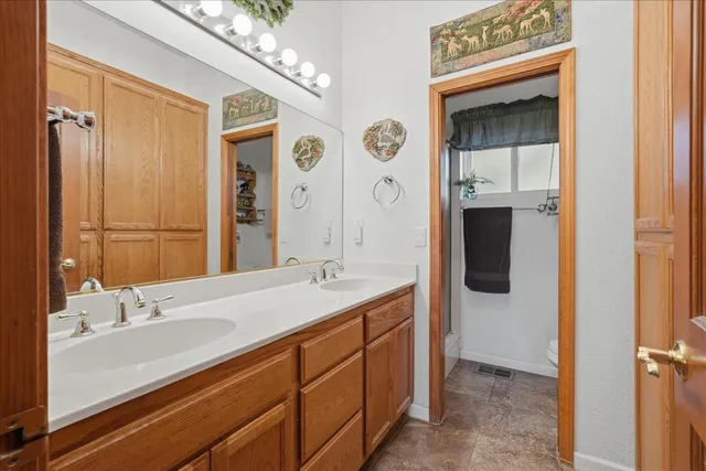 a bathroom with a sink toilet and shower