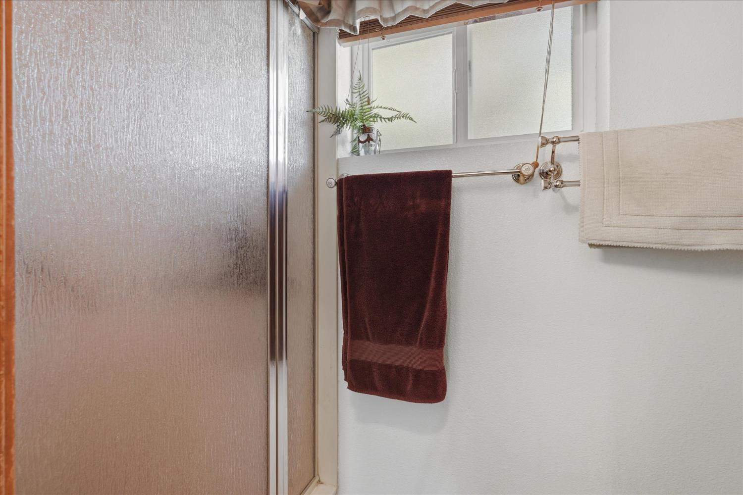 43319 Leach Road Ahwahnee, CA 93601 - Photo 38 of 61 a bathroom with a shower and a mirror