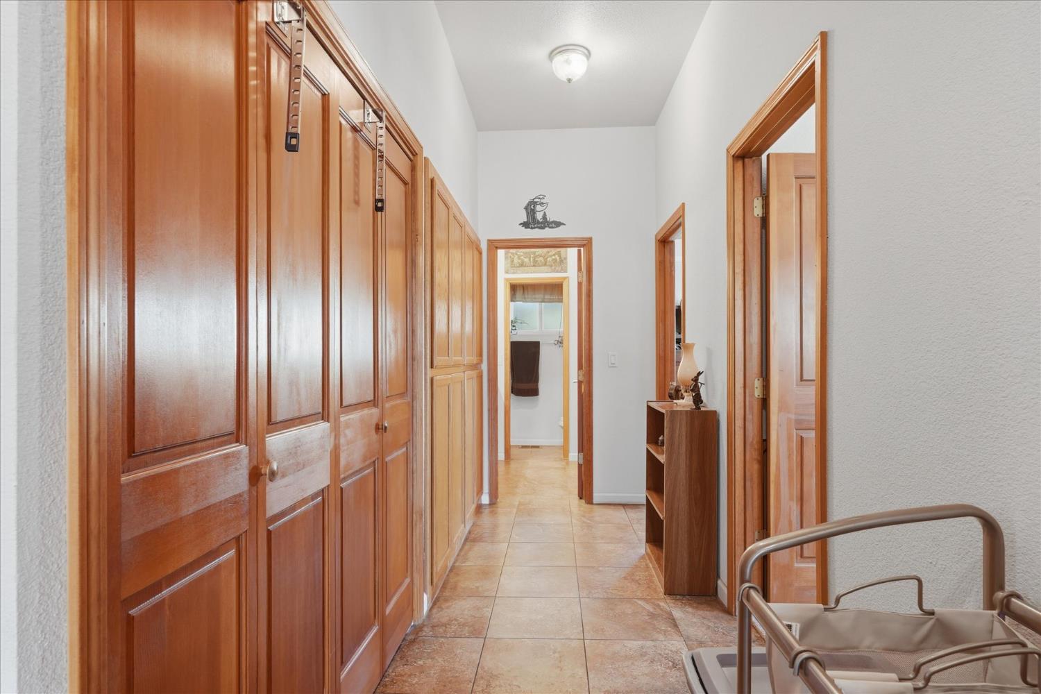 43319 Leach Road Ahwahnee, CA 93601 - Photo 39 of 61 a view of a hallway with wooden floor and staircase