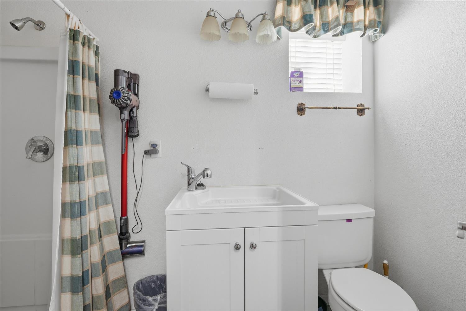 43319 Leach Road Ahwahnee, CA 93601 - Photo 44 of 61 a bathroom with a sink toilet and shower