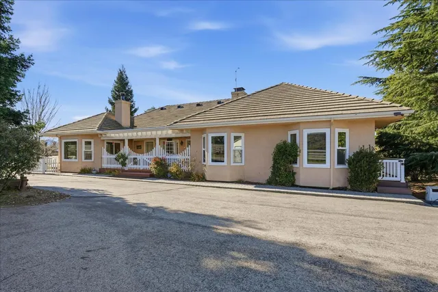 front view of a house with a garden