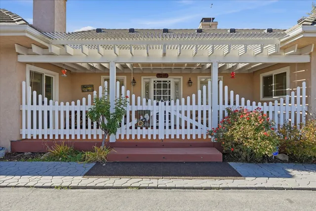 a balcony with furniture and wooden floor