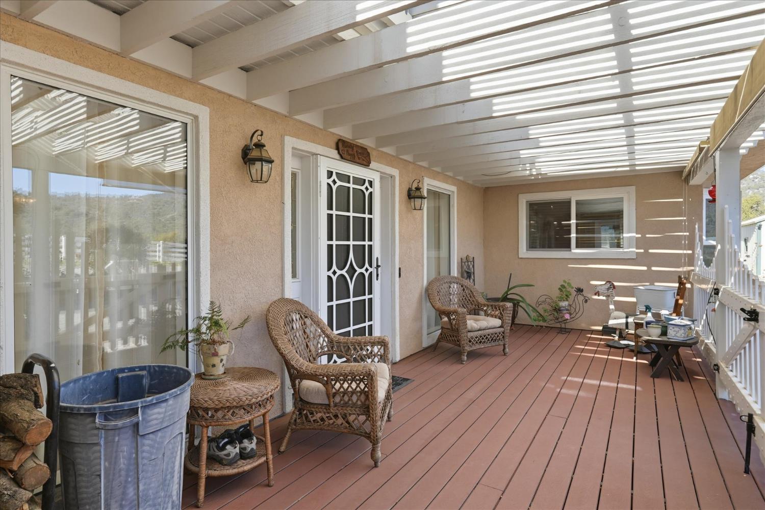 43319 Leach Road Ahwahnee, CA 93601 - Photo 9 of 61 a balcony with furniture and wooden floor