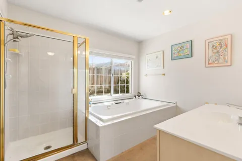 a view of bathroom with dual sinks