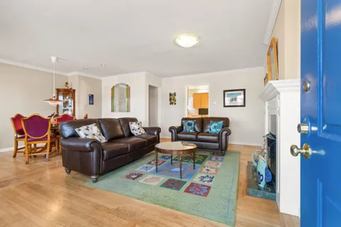 a living room with furniture and a table