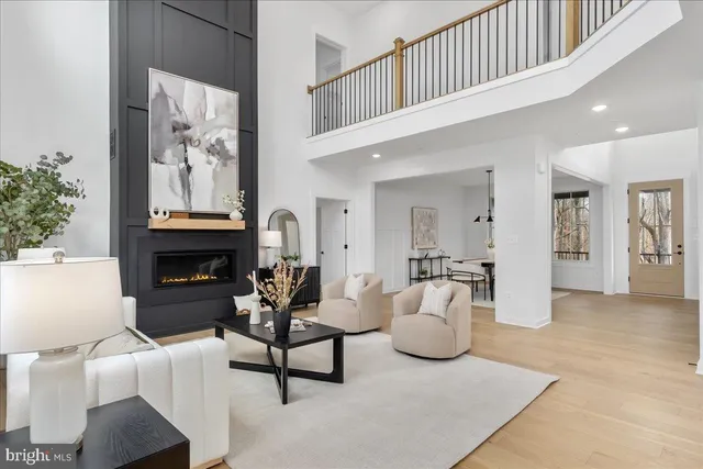 a kitchen with stainless steel appliances granite countertop a stove and a wooden floors