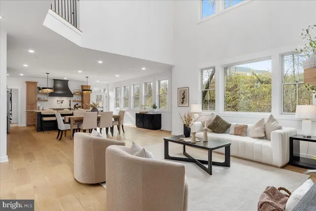 a living room with furniture a window and a table