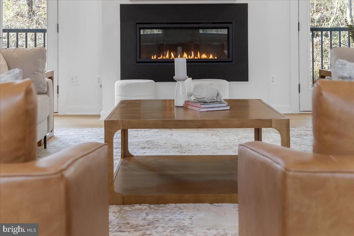3520 Castle Way Davidsonville, MD 21035 - Photo 39 of 87 Modern elegance with a cozy fireplace glow.