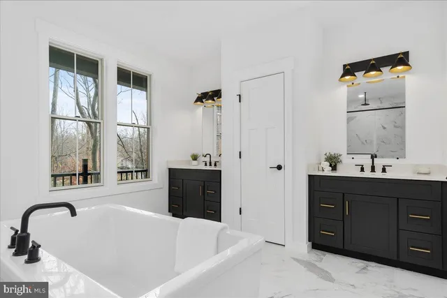 a front view of a house with large windows