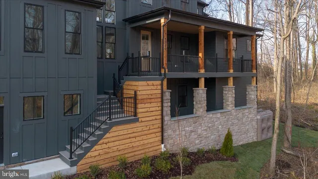 a view of a bedroom with furniture and staircase