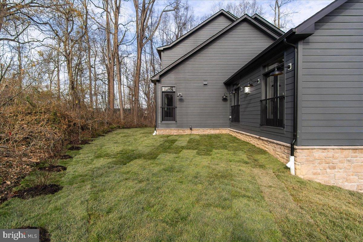 3520 Castle Way Davidsonville, MD 21035 - Photo 76 of 87 Serene backyard retreat with lush greenery.