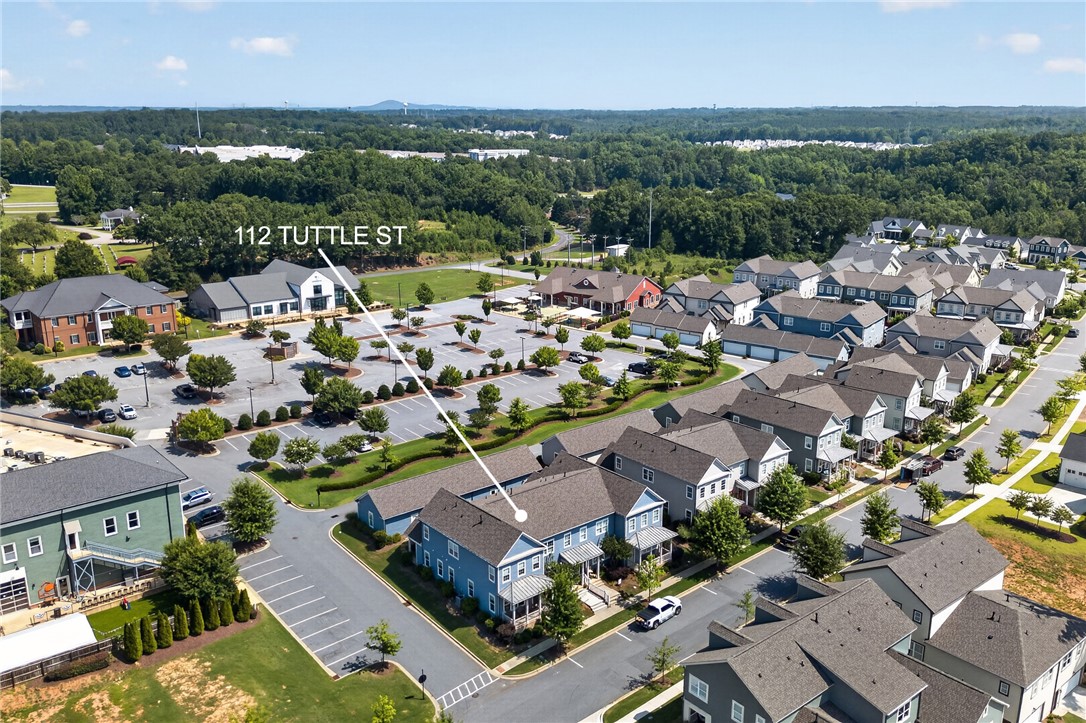 112 Tuttle Street Clemson, SC 29631 - Photo 36 of 46 An aerial perspective reveals a vibrant community of homes nestled amidst verdant landscaping and ample parking.