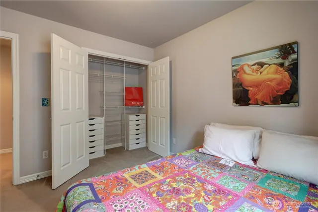 a bedroom with a bed and a television