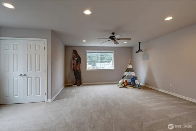 a view of a room with gym equipment and a window