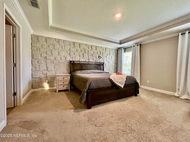 a living room with furniture and a book shelf