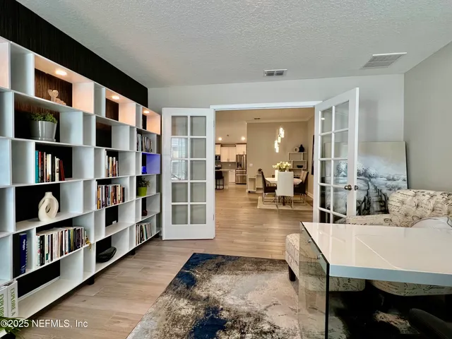 a view of a swimming pool with an outdoor seating